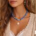 Lifestyle image of Bead & Braid Collective blue Kumihimo necklace with rose quartz pendant, handmade statement jewelry
